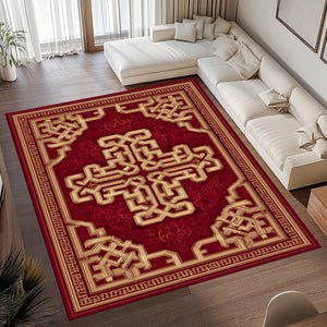 May include: A rectangular red area rug with a gold geometric pattern. The rug features a central design and a border with intricate detailing. The rug is placed on a wooden floor in a living room setting.