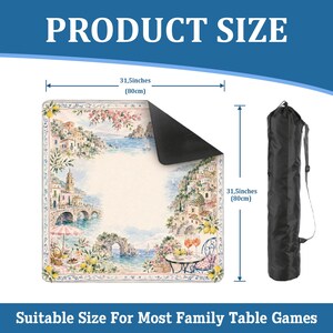 May include: A square game mat featuring a coastal Mediterranean scene with lemons, buildings, and a bridge, measuring 31.5 inches by 31.5 inches. The mat has a black underside and comes with a black cylindrical carrying bag with a shoulder strap.