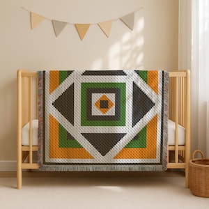 May include: A geometric patterned blanket in shades of green, orange, white, and brown is draped over a wooden crib. The blanket features a repeating square and diamond design. A small, woven basket sits on the floor near the crib.