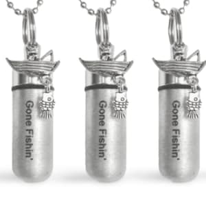 May include: Five silver-toned pendants with a boat and fish charm. Each pendant has the text "Gone Fishin'" engraved on it.