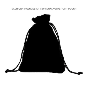 May include: A black velvet gift pouch with a drawstring closure. The pouch is made of a soft, opaque material and is designed to hold small items. Text at the top reads: EACH URN INCLUDES AN INDIVIDUAL VELVET GIFT POUCH.