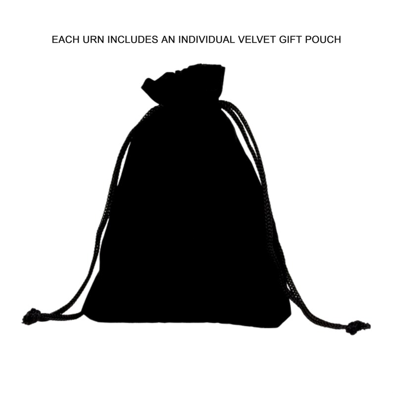 May include: A black velvet gift pouch with a drawstring closure. The pouch is made of a soft, opaque material and is designed to hold small items. Text at the top reads: EACH URN INCLUDES AN INDIVIDUAL VELVET GIFT POUCH.