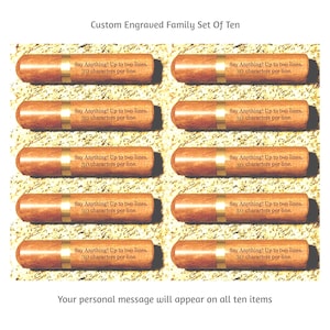 May include: A set of ten custom engraved items. Each item is cylindrical, with a light brown wooden finish and a gold band. The text "Say Anything! Up to two lines, 30 characters per line" is engraved on each item.