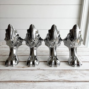 Set of 4 matching vintage furniture legs in cast metal with a bright chrome finish.