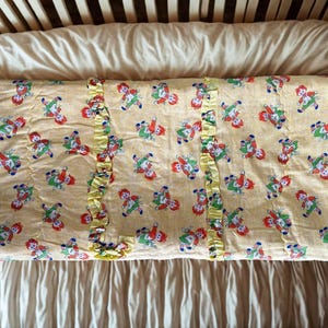Vintage 50s baby quilt, Raggedy Ann & Andy pattern, yellow satin fabric with ruffles, handmade retro blanket
