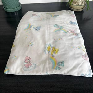 Vintage Care Bears crib fitted sheet and pillowcase set with pastel rainbow and cloud print 1980s baby bedding nursery cotton fabric