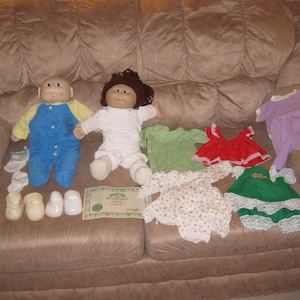 Two Vintage Cabbage Patch Dolls and Clothing, One Xavier Roberts with Birth Certificate, One Hand Made with Included Pattern