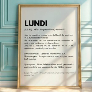 May include: A framed print with a white background and black text. The text defines the word "Lundi" (French for Monday) as a dreaded state of mind, describing it as a transition from weekend freedom to the reality of waking up. It also includes synonyms like "blues" and "crash post-weekend".