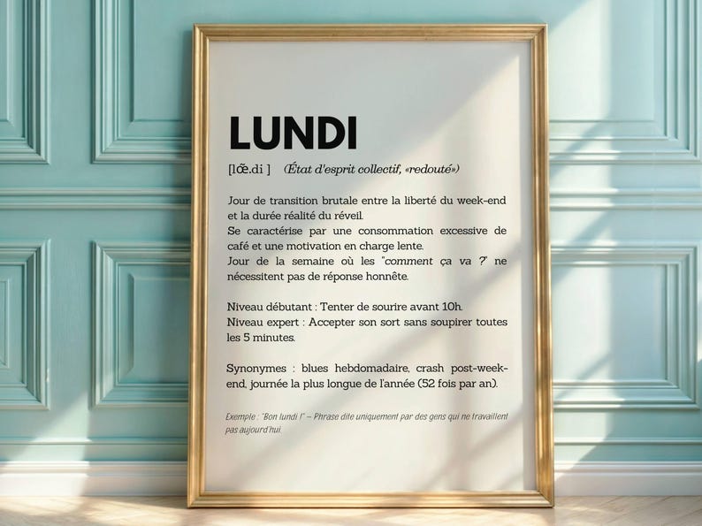May include: A framed print with a white background and black text. The text defines the word "Lundi" (French for Monday) as a dreaded state of mind, describing it as a transition from weekend freedom to the reality of waking up. It also includes synonyms like "blues" and "crash post-weekend".