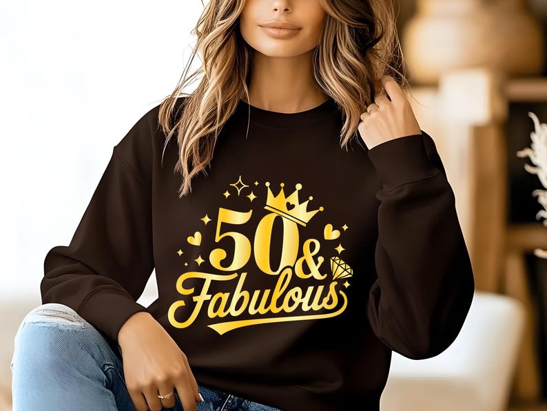 May include: A black sweatshirt with a gold graphic that says "50 & Fabulous" with a crown and a diamond.
