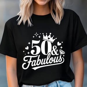 May include: Black t-shirt with white text that says "50 & Fabulous" with a crown and a diamond graphic.