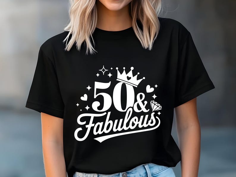 May include: Black t-shirt with white text that says "50 & Fabulous" with a crown and a diamond graphic.