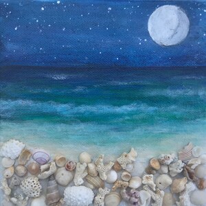 May include: A painting of a seascape at night with a full moon and stars in the sky. The ocean is a deep blue and green color, and the beach is white with a variety of seashells scattered across it.