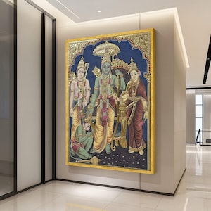 May include: A framed, colorful painting depicting a religious scene with multiple figures. The artwork features detailed figures in traditional attire, set against a blue backdrop with gold accents. The frame is gold.
