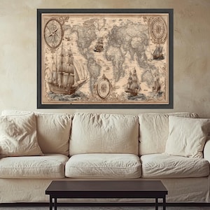 May include: A framed vintage world map print in sepia tones. The map shows detailed continents, oceans, and illustrations of sailing ships and compasses. The print is displayed above a beige sofa and a dark brown table.