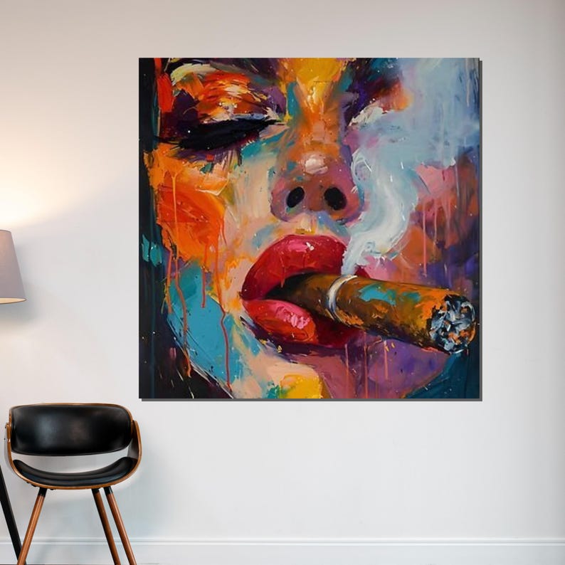 May include: Colorful abstract painting of a face with closed eyes and red lips smoking a cigar. The artwork features vibrant hues of orange, blue, purple, and yellow, with wisps of smoke.