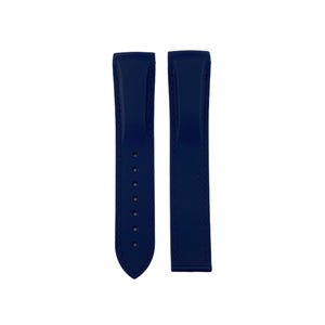 May include: Two navy blue watch straps. One strap has several holes for adjustment and a pointed end. The other strap is a solid piece. Both straps are made of a smooth material.