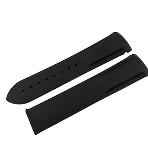 May include: Two black rubber watch straps, one with holes for adjusting the size and one without.