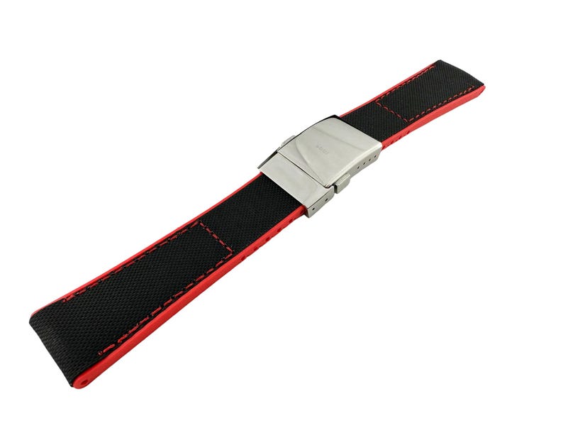May include: A black and red watch strap with a silver buckle. The strap is made of a textured fabric with red stitching.