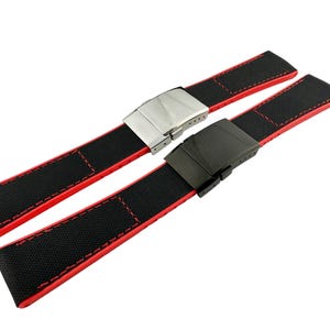May include: Two black watch straps with red stitching and different metal buckles. One buckle is silver and the other is black.