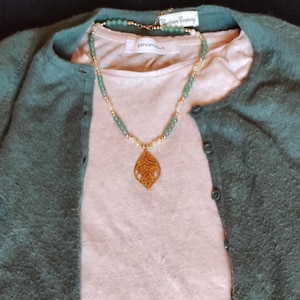 Natural stone necklace with gold-plated stainless steel leaf pendant