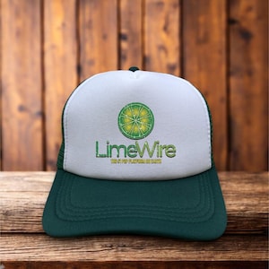 May include: A white and green trucker hat with a lime wedge and the text "LimeWire" in green and yellow. The text below the logo reads "The #1 P2P Software On Earth".