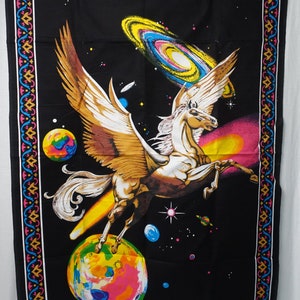 May include: Black tapestry featuring a winged horse, planets, and galaxies. The horse has tan wings and a white body, set against a black background with colorful planets and stars. The border has a decorative pattern.