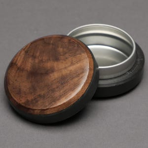 May include: A rustic wooden sign with the text "Welcome to our home" in white lettering. The sign features a distressed finish and a simple, inviting design, perfect for entryway decor.