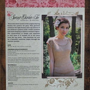May include: A printed pattern for a knitted Spring Garden Tee, featuring a photo of a woman wearing the finished garment. The tee is a light beige color with cap sleeves. The pattern includes sizing and material information.