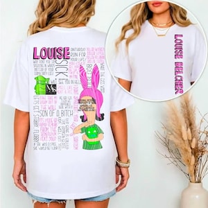 May include: A white t-shirt featuring a graphic of the character Louise Belcher with pink bunny ears and a green shirt. The back displays various text quotes in pink and black, while the front chest area shows the name Louise Belcher vertically.