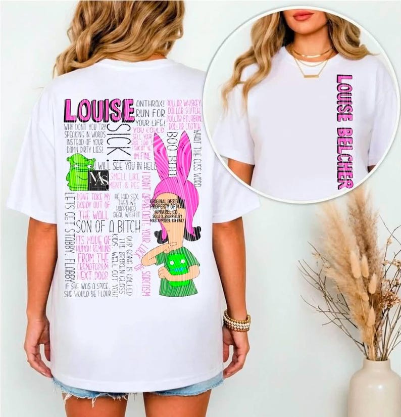 May include: A white t-shirt featuring a graphic of the character Louise Belcher with pink bunny ears and a green shirt. The back displays various text quotes in pink and black, while the front chest area shows the name Louise Belcher vertically.