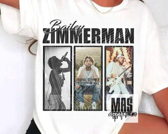 May include: White t-shirt featuring the name "Bailey Zimmerman" above three framed images. The images depict Zimmerman in various poses, including singing and playing guitar. The text "MAS Apparel Co" is also visible.