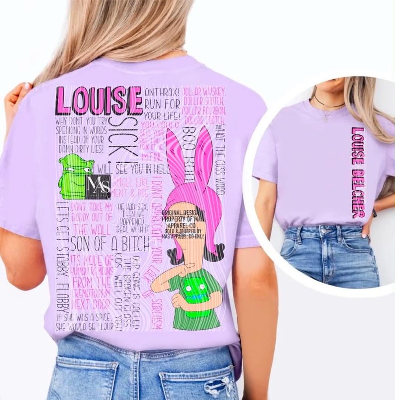 May include: A light purple t-shirt featuring a large graphic on the back with the name LOUISE in pink, a cartoon character with pink bunny ears, a green creature, and various text quotes. The front of the shirt displays the text LOUISE BELCHER vertically.