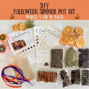 May include: A DIY Halloween simmer pot kit containing dried orange slices, cinnamon sticks, star anise, bay leaves, and other spices in clear plastic bags. Includes printed instruction cards, empty pouches, and orange and purple ribbons for assembly.
