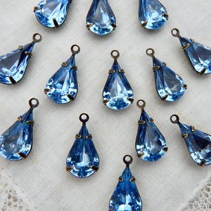 4 Light Sapphire Blue drops 14x7mm glass jewels in antique setting One Loop