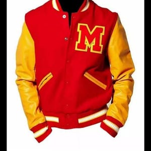 May include: Red and yellow varsity jacket with a large letter "M" on the chest. The jacket has a red body, yellow sleeves, and white trim on the cuffs, collar, and waist. A classic athletic-inspired outerwear piece.