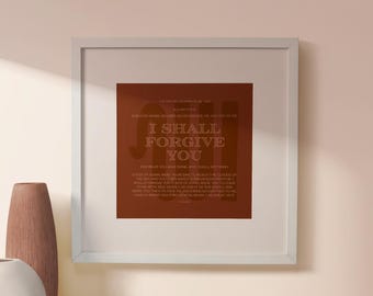 May include: Framed artwork with the text "I SHALL FORGIVE YOU" in a white font on a dark orange background. The artwork is in a white frame and is displayed on a light pink wall. A brown vase and a white vase are in the foreground.