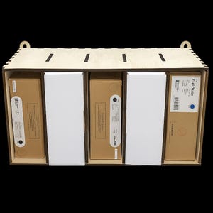 May include: A wooden storage box with a roof-shaped top, holding several rectangular boxes. The boxes are a mix of white and brown, some with Japanese text and labels. The box has a natural wood finish against a black background.