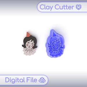 Könnte beinhalten: Ein blauer Ton-Ausstecher und eine fertige Tonfigur einer Frau mit Partyhut und Rüschenkragen. Die fertige Tonfigur hat schwarzes Haar, einen roten Hut und ein rosa Gesicht. Der Text "Clay Cutter" und "Digital File" sind sichtbar.