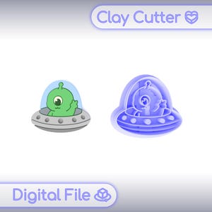 May include: A digital file for a clay cutter featuring a green one-eyed alien inside a grey flying saucer. The design includes a 3D-printed style purple plastic cutter outline next to the colored graphic. The text Clay Cutter and Digital File appear.