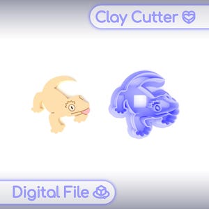 May include: A tan gecko clay cutter and a blue gecko-shaped clay cutter. The tan gecko has a pink tongue and a detailed eye. The blue cutter is a mold of the gecko. The text "Clay Cutter" and "Digital File" are visible.