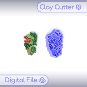 Puede incluir: Un cortador de arcilla verde y marrón y un cortador de arcilla azul a juego con forma de planta con una boca grande. El texto "Clay Cutter" y "Digital File" se muestran en la imagen.