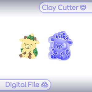 May include: Two cow-shaped clay cutters, one yellow and green, the other blue. The yellow cow has a smiling face and leaf details. The blue cutter is a mold of the cow. Text at the top reads "Clay Cutter" and at the bottom "Digital File".