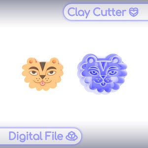 May include: Two clay cutters in the shape of a tiger's face. One is orange with black and brown details, the other is blue. The text "Clay Cutter" and "Digital File" are in the image.
