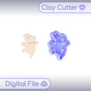 以下が含まれることがあります： ベージュのカバの形をした粘土の切り抜きと、青いカバの形をした粘土カッター。画像には「Clay Cutter」と「Digital File」の文字が表示されています。カバは踊りのポーズをとっています。