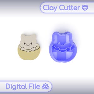 May include: A light beige clay cutter and a blue clay cutter in the shape of a cat in an egg. The clay cutter is a digital file. The text "Clay Cutter" and "Digital File" are in the image.