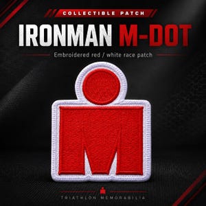 May include: An embroidered Ironman M-Dot patch featuring a red letter M shape topped with a red circle, all outlined in white thread. The text COLLECTIBLE PATCH, IRONMAN M-DOT, and Embroidered red / white race patch are visible in the image.