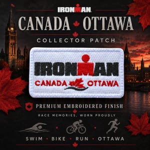 May include: A rectangular embroidered collector patch with a white background. The text IRONMAN is stitched in black with a red M-dot logo. Below, the text CANADA OTTAWA appears in red, featuring a small red maple leaf and a black wave graphic.
