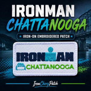 May include: A rectangular iron-on embroidered patch with a white background. The patch features the text IRONMAN in dark blue, a light blue stylized figure, and the word CHATTANOOGA in green, accompanied by a small light blue bridge icon.