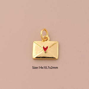 May include: Gold-colored envelope charm with a red heart on the front. Size: 14x10.7x2mm.